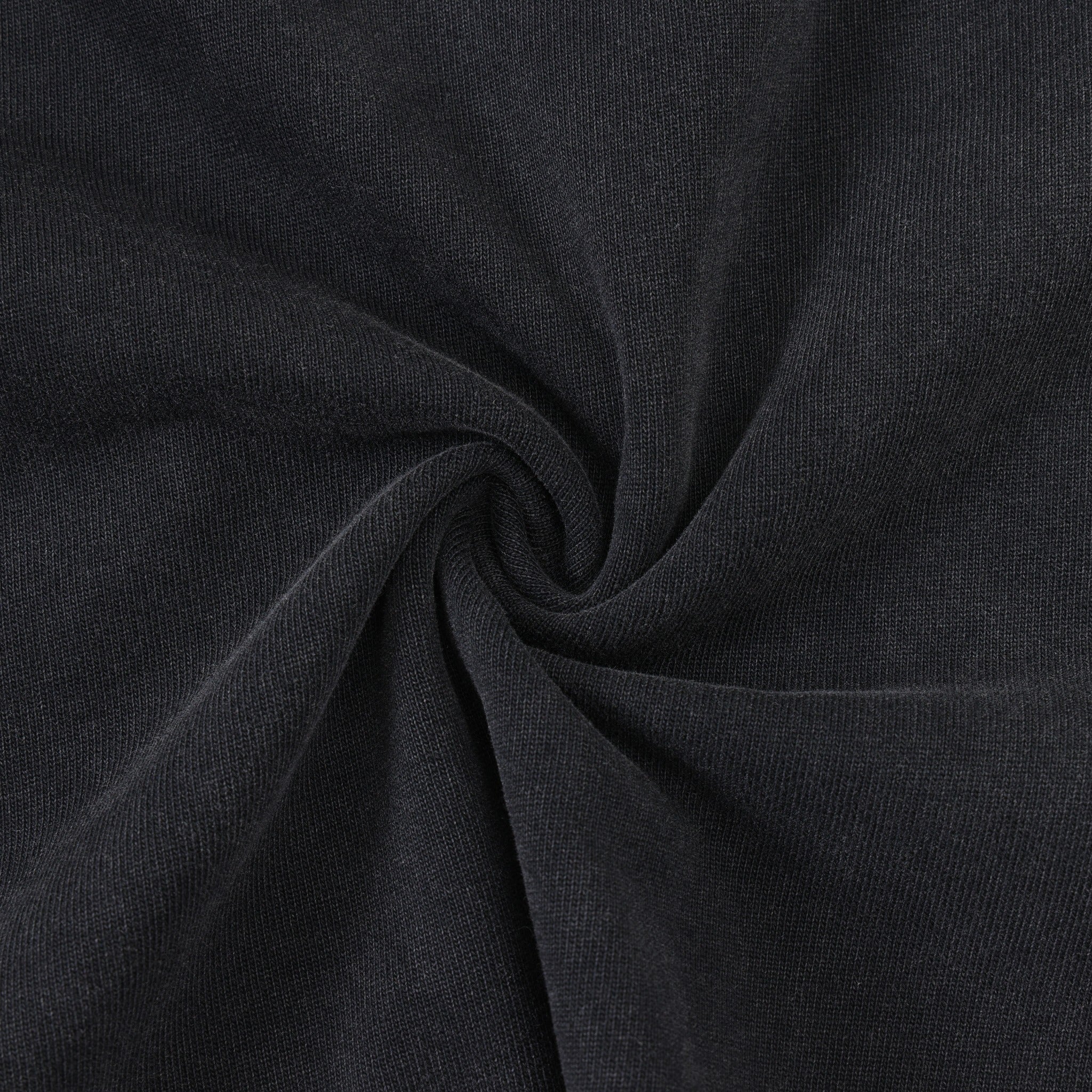 Fountain Tee – Black – Close-up of black fabric gathered to show knit texture