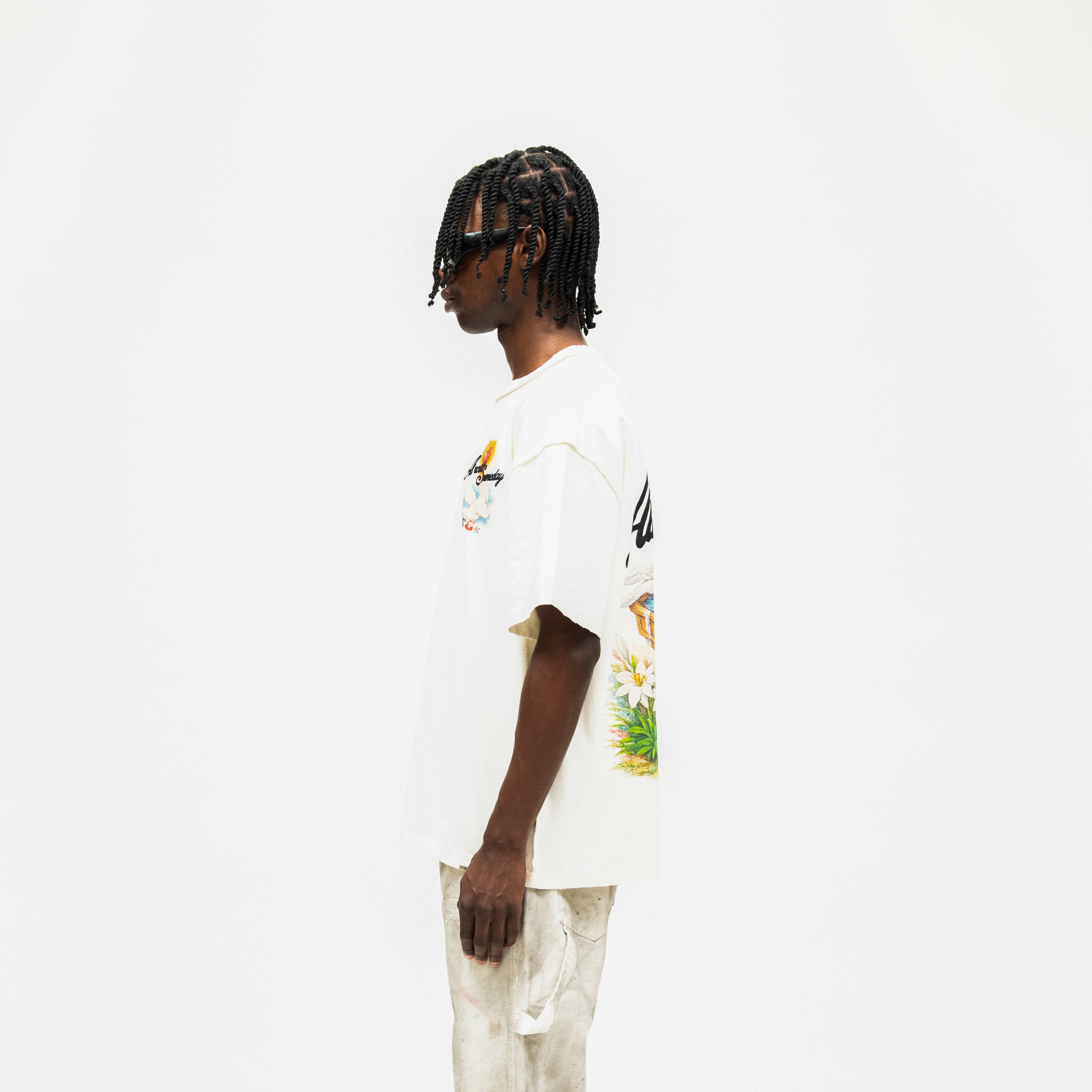 Fountain Tee – Cream – Side view on model showing sleeve shape and partial back graphic