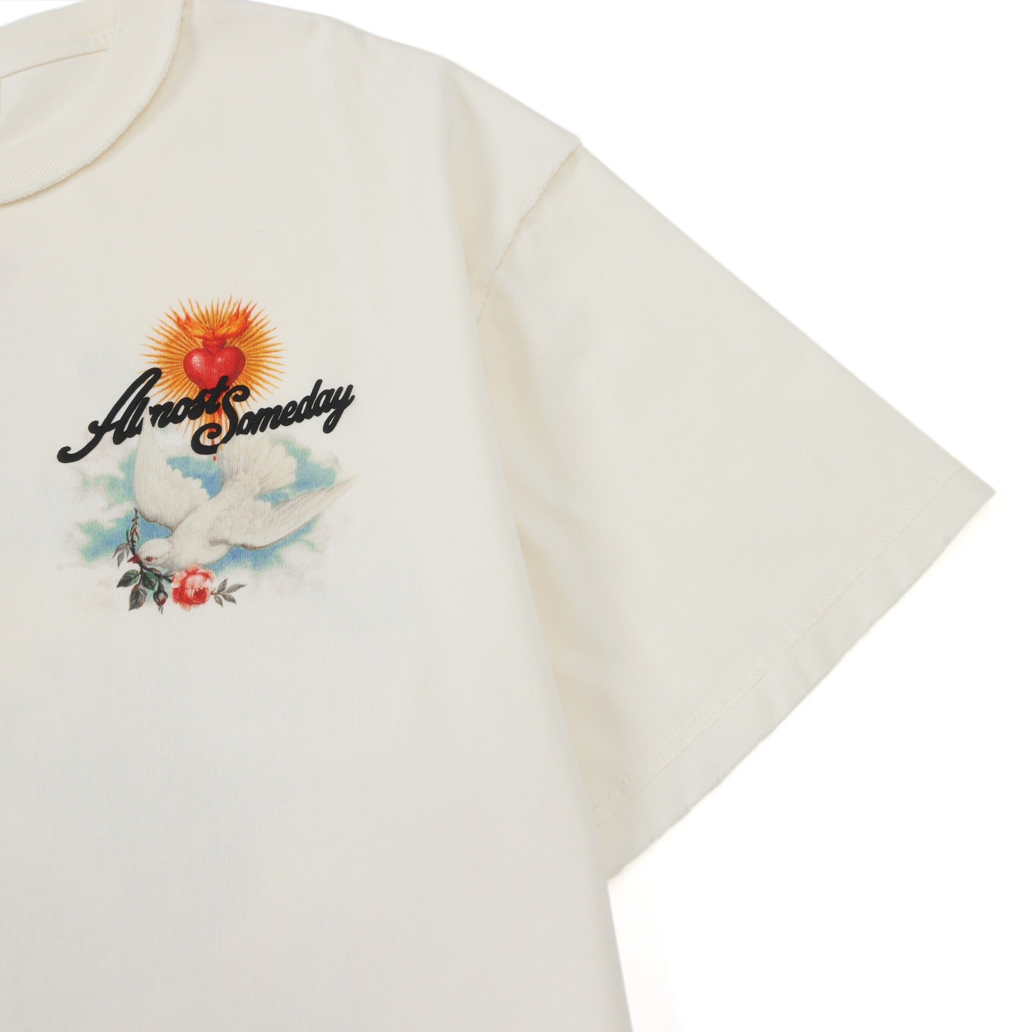 Fountain Tee – Cream – Angled chest detail showing graphic and short sleeve