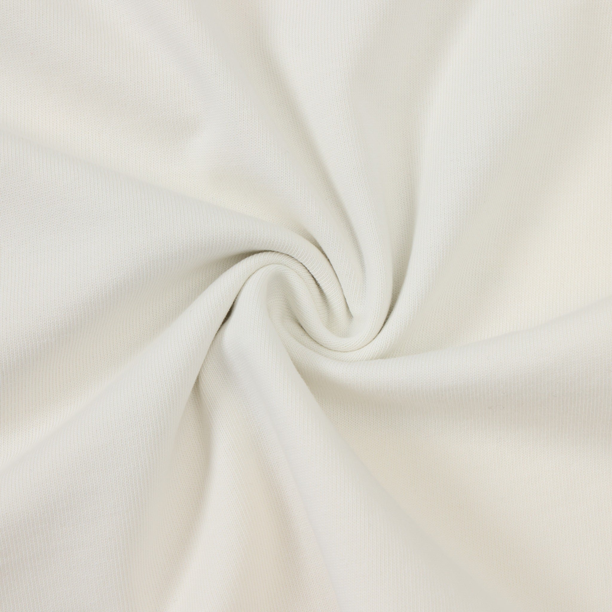 Fountain Tee – Cream – Close-up of fabric texture arranged in soft folds