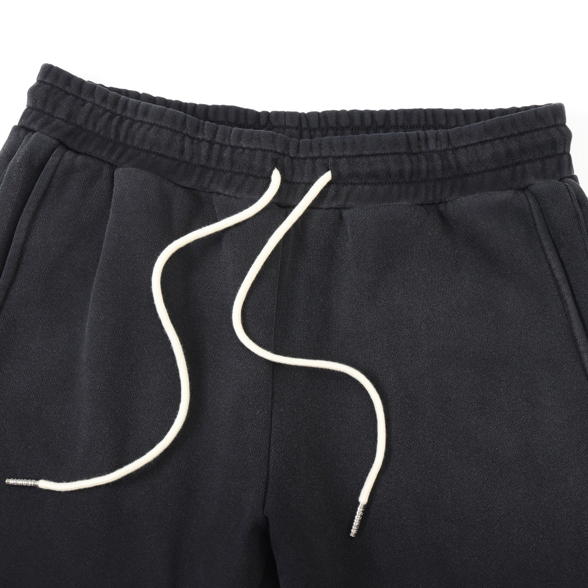 League Flare Sweatpants – Black – Close-up of elastic waistband, side pockets, and white drawstrings