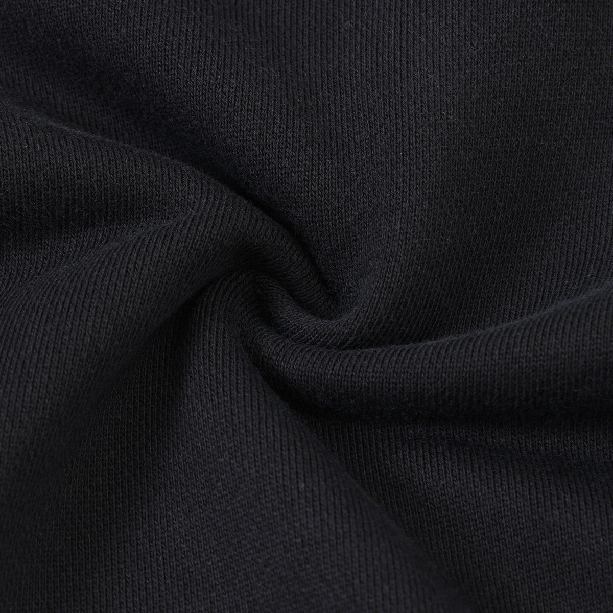 League Flare Sweatpants – Black – Close-up of black fabric gathered to show texture