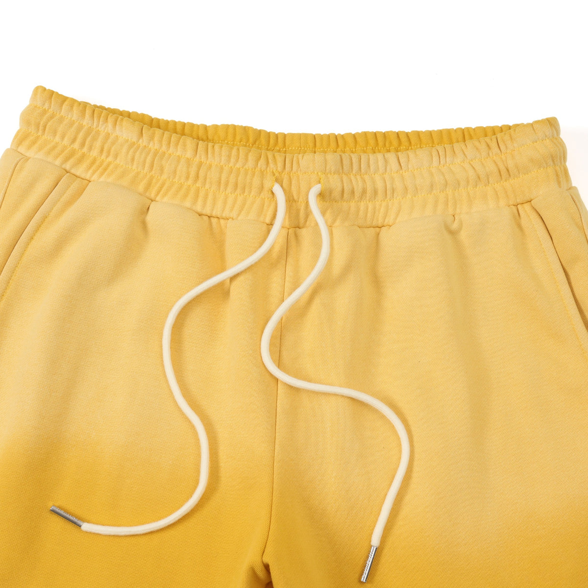League Flare Sweatpants – Yellow – Close-up of elastic waistband, side pockets, and white drawstrings