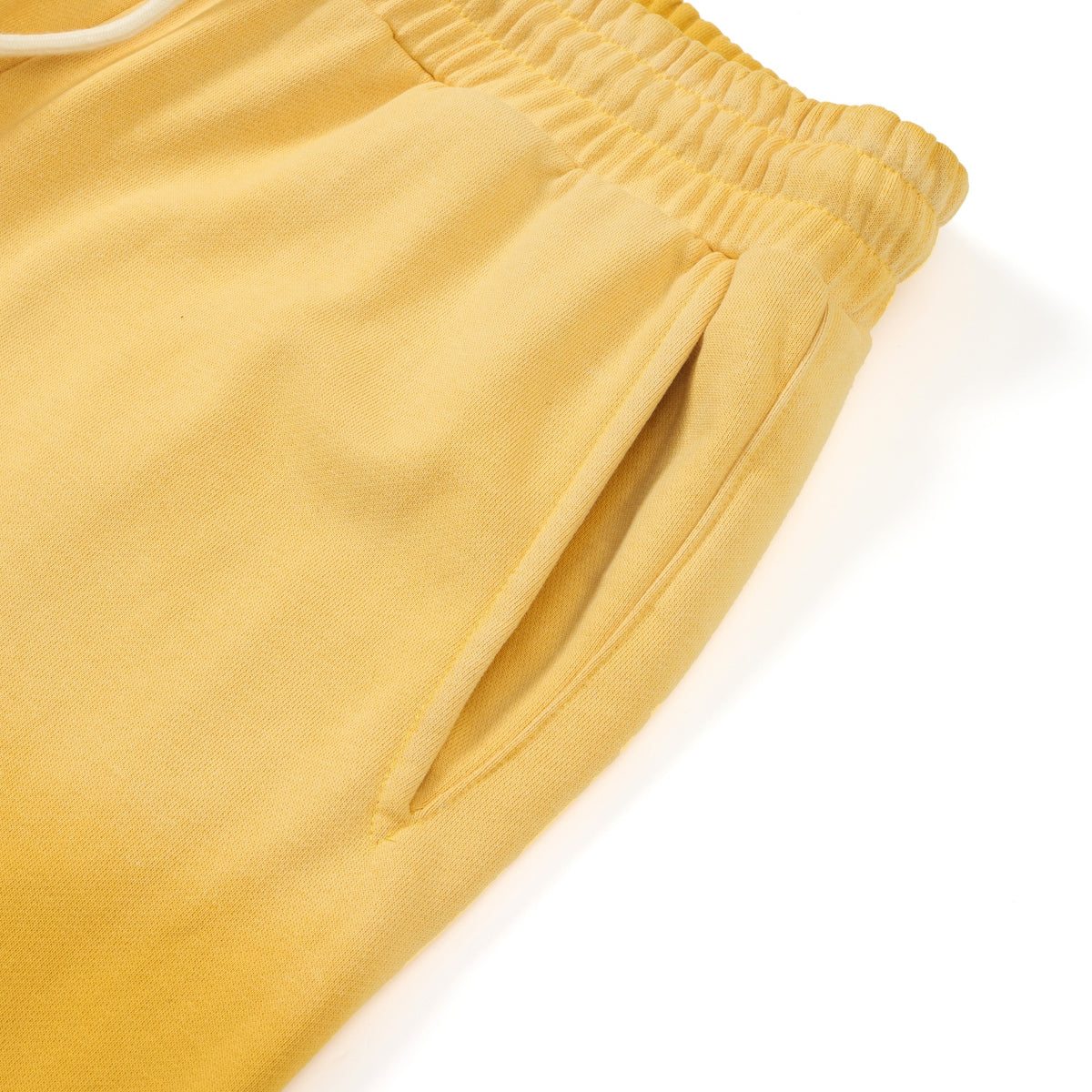 League Flare Sweatpants – Yellow – Close-up of side pocket opening and elastic waistband