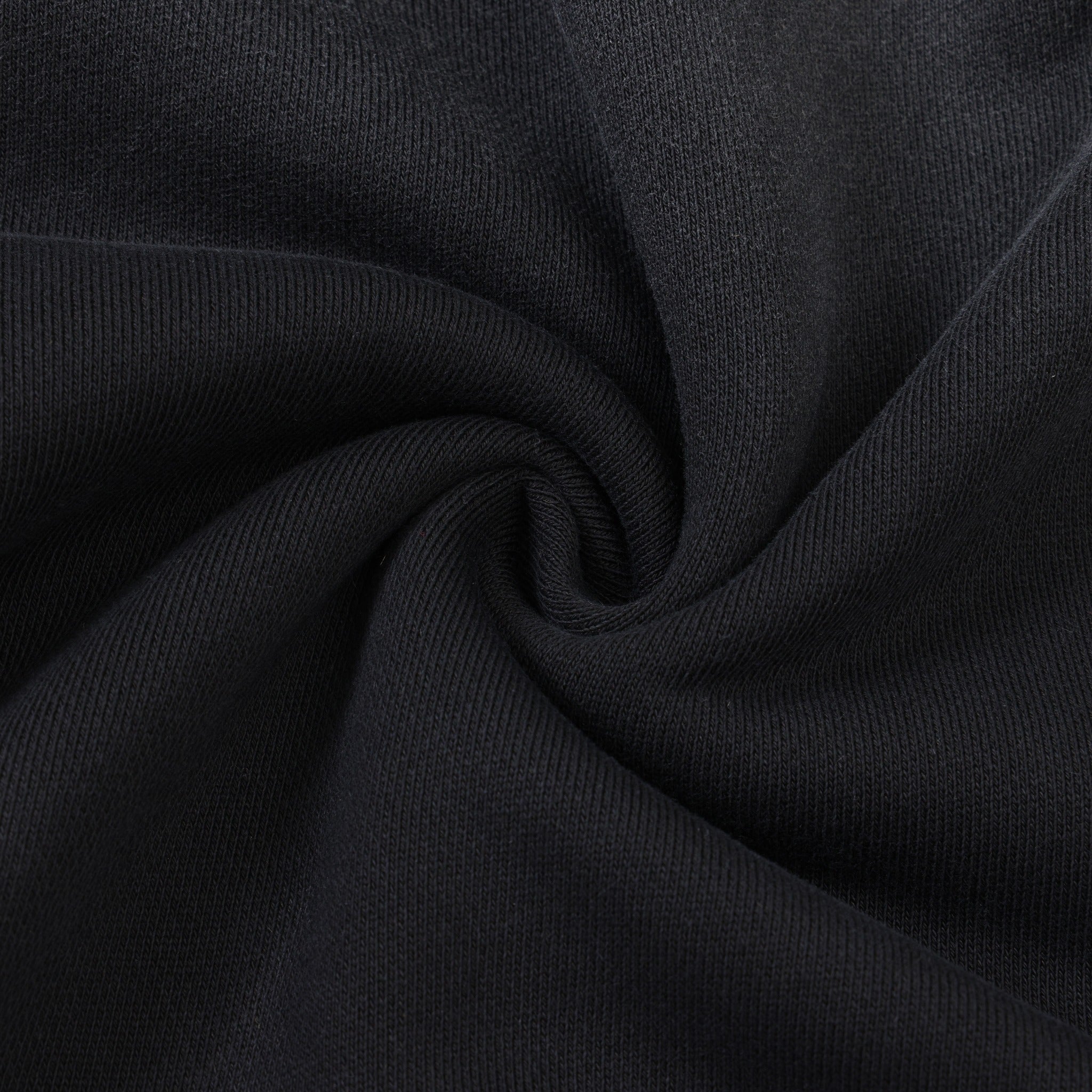League Hoodie – Black – Close-up of black fabric gathered to show texture