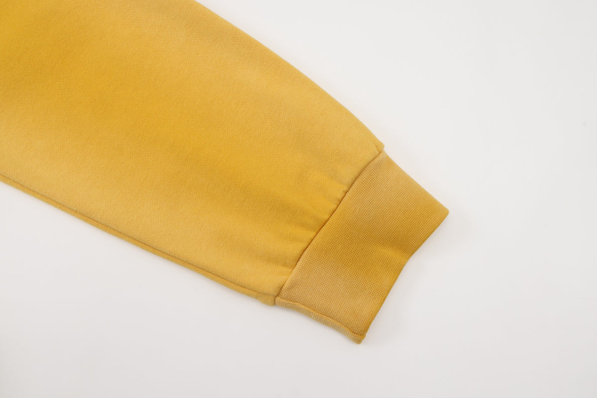 League Hoodie – Yellow – Close-up of sleeve and ribbed cuff
