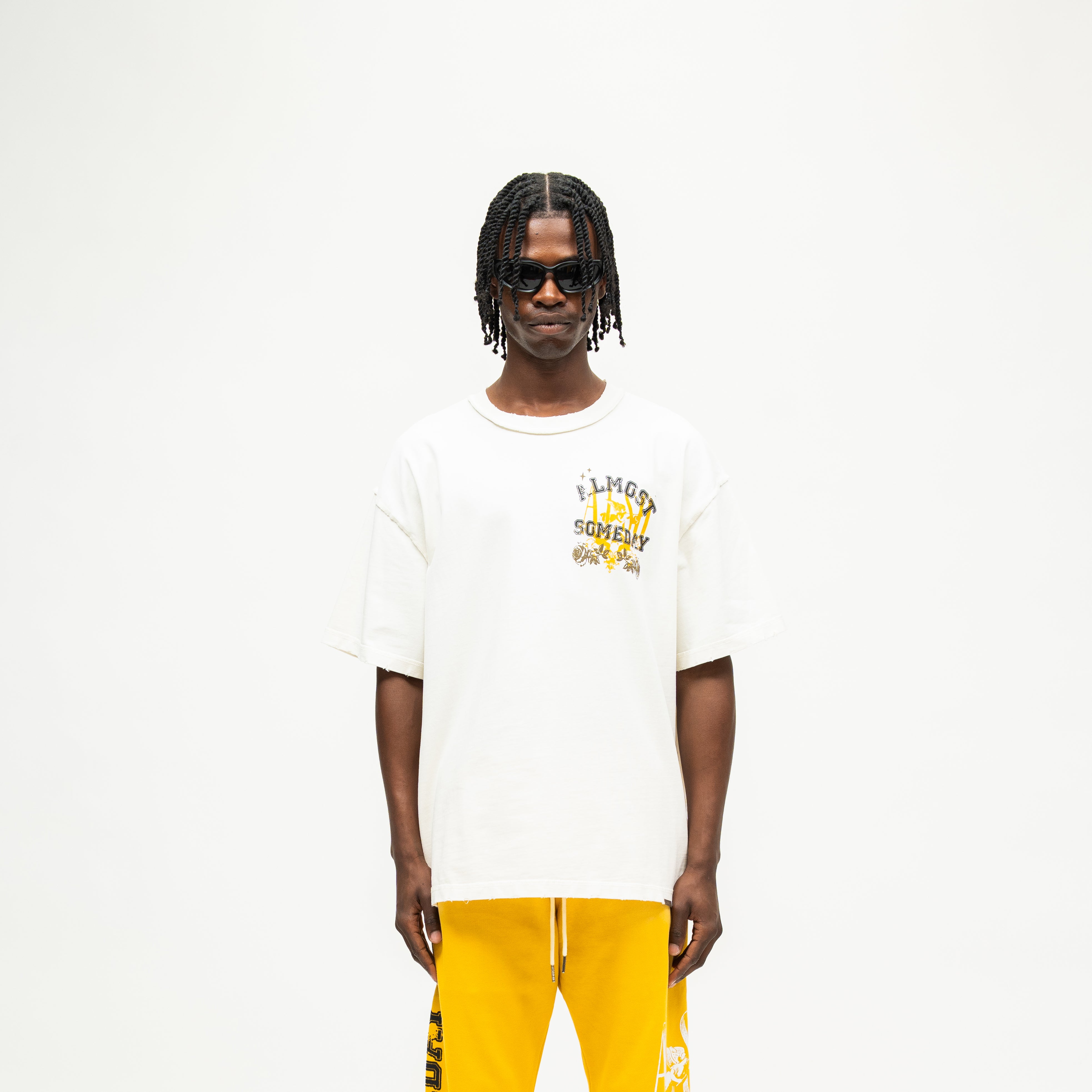 League Tee – Cream – Front view on model showing chest graphic and boxy fit
