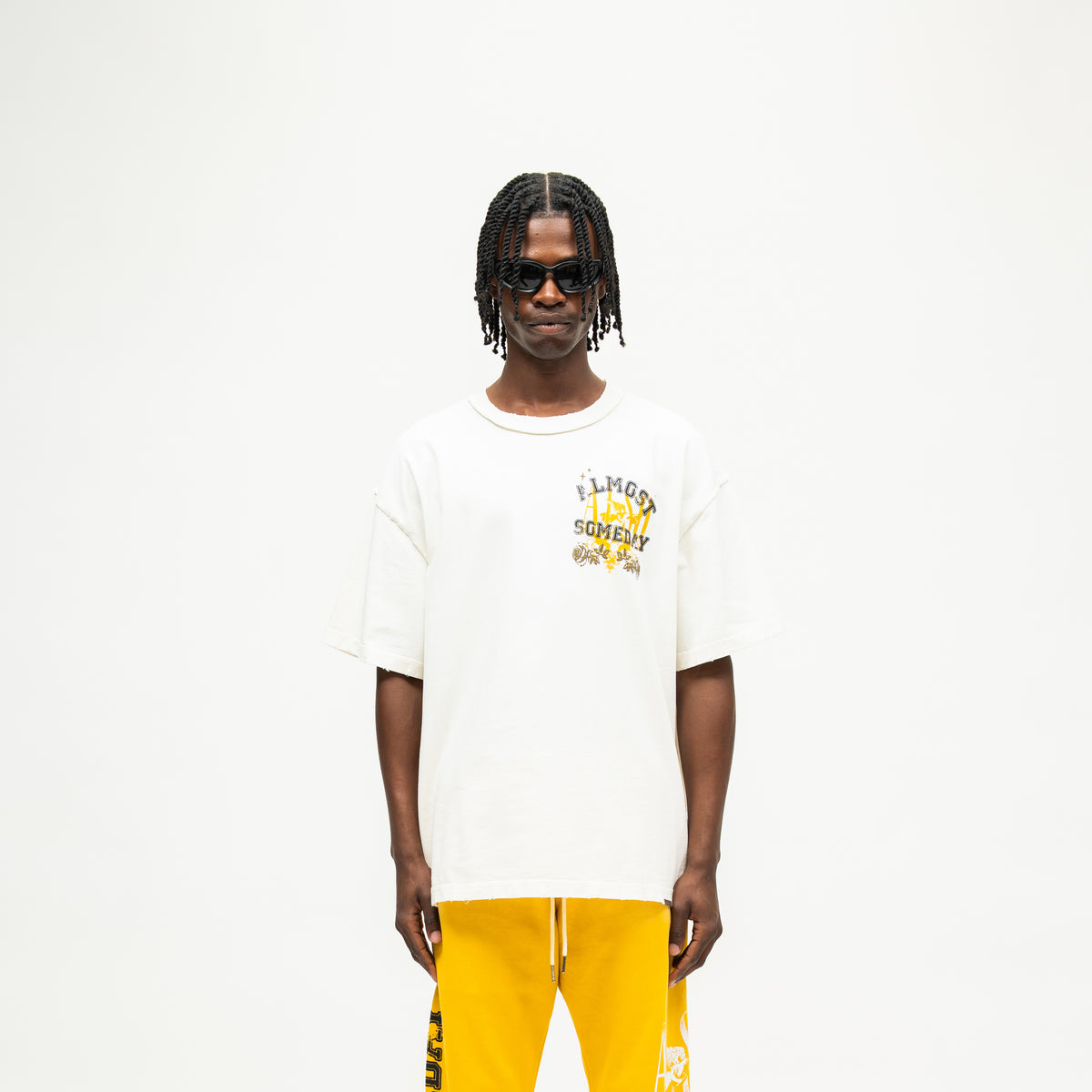 League Tee – Cream – Front view on model showing chest graphic and boxy fit