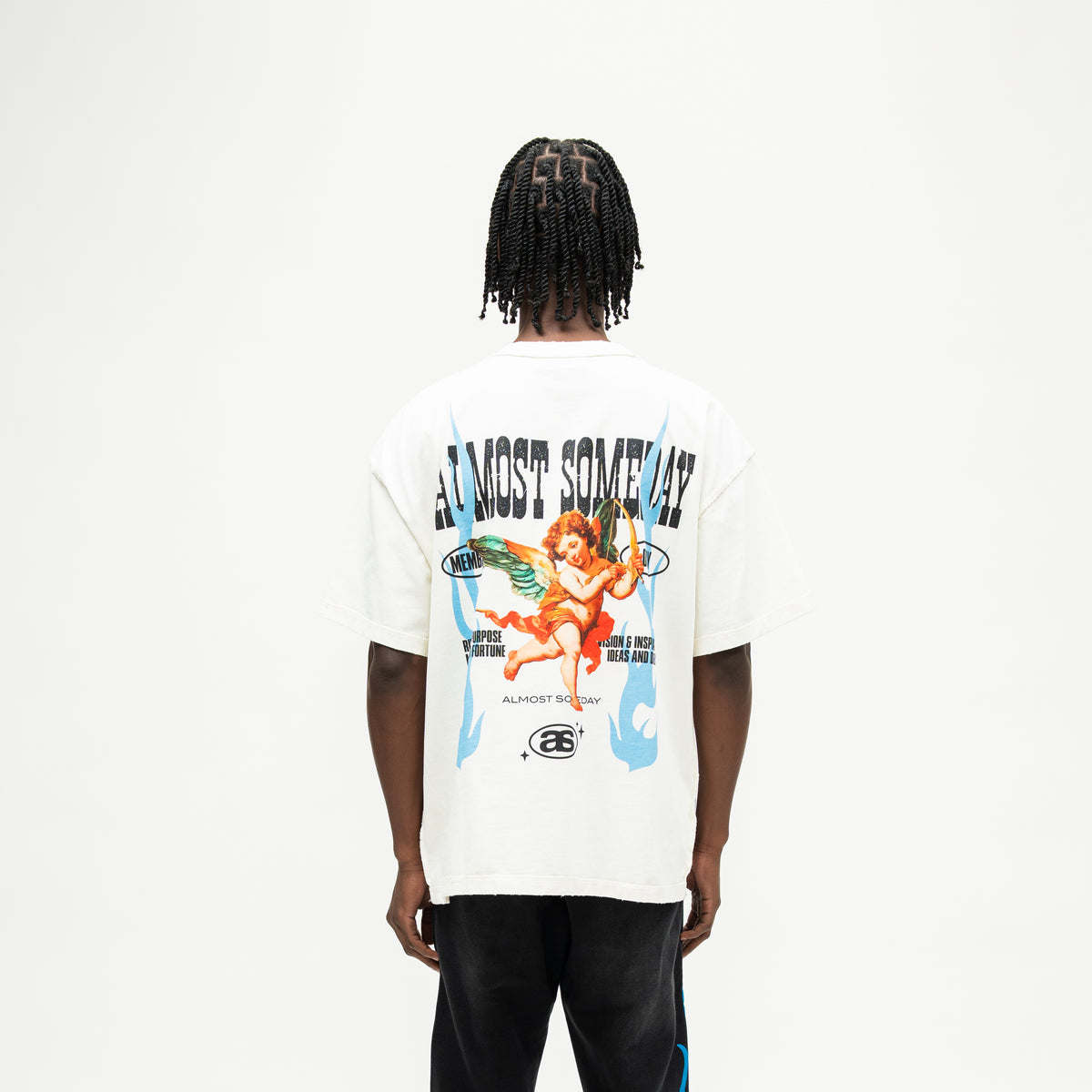 Members Tee – Cream – Back view on model showing winged cherub with bow, blue flames, Almost Someday lettering