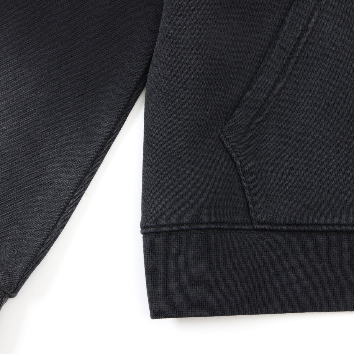 Members Zip Hoodie – Black – Close-up of ribbed bottom hem and front pocket edge