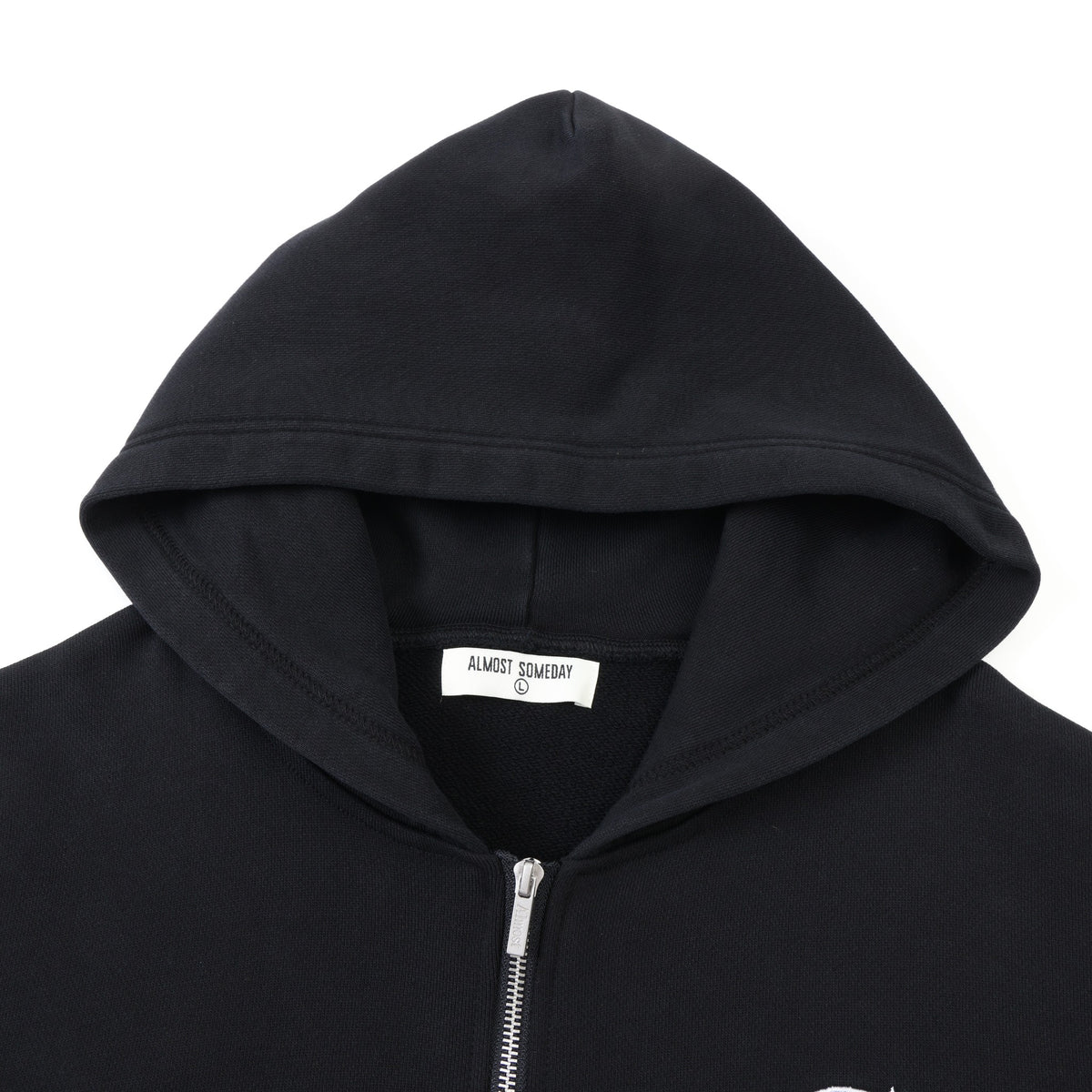 Members Zip Hoodie – Black – Close-up of hood, interior brand label, and metal zipper pull