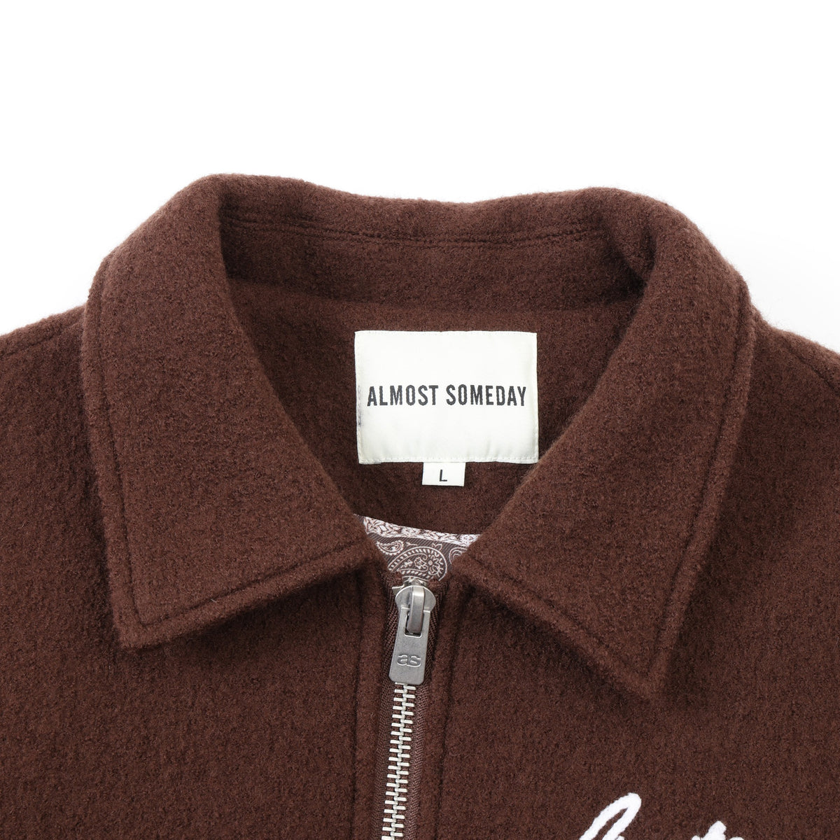 Saint Cropped Wool Jacket – Brown – Close-up of pointed collar, interior brand label, and metal zipper pull