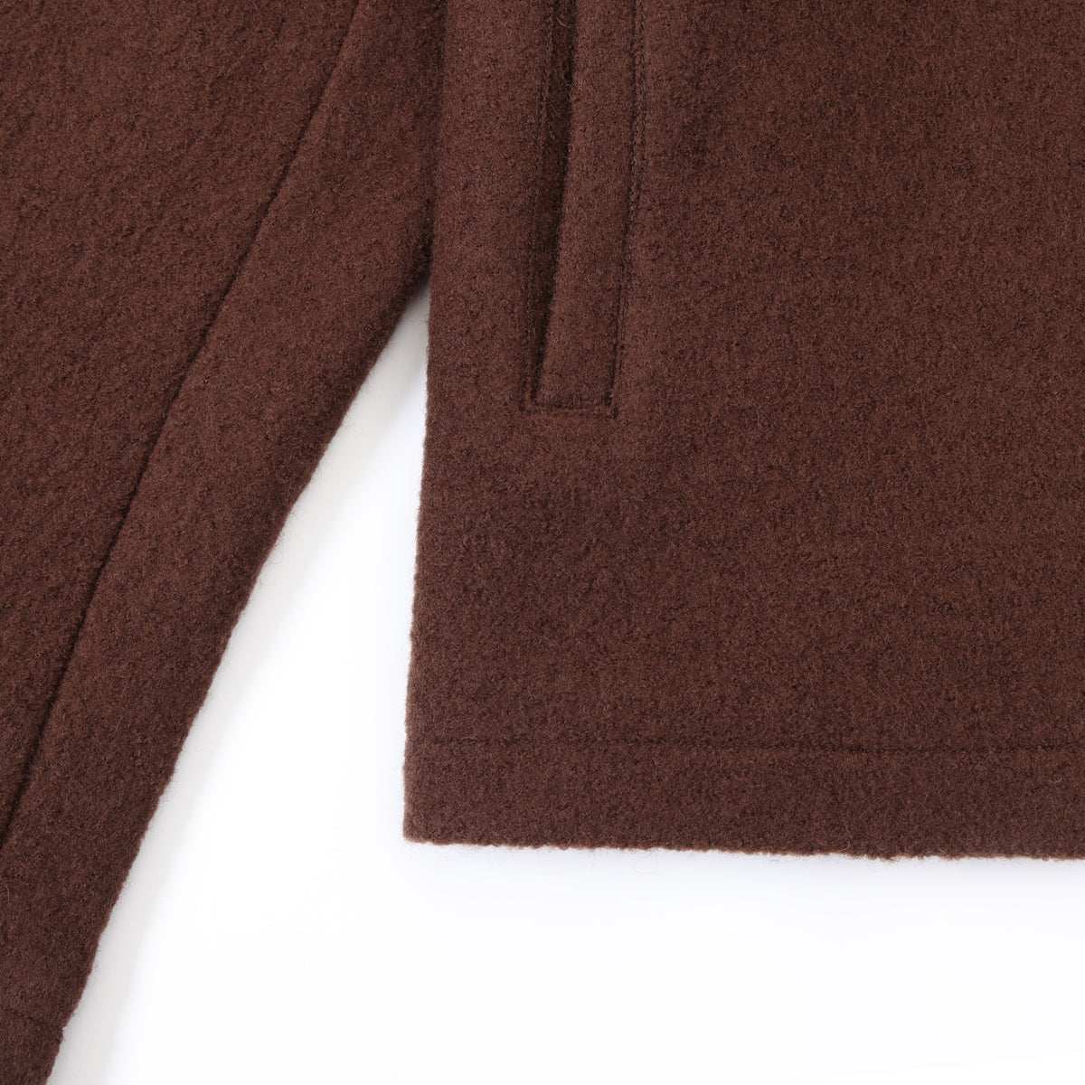 Saint Cropped Wool Jacket – Brown – Close-up of cropped bottom hem, sleeve seam, and front pocket
