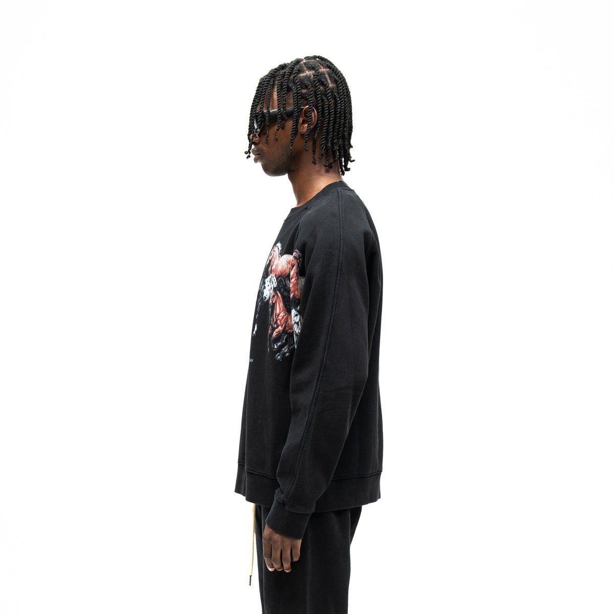 Smoke Crewneck – Black – Side view on model showing long sleeve seam, ribbed cuff, and partial horse graphic