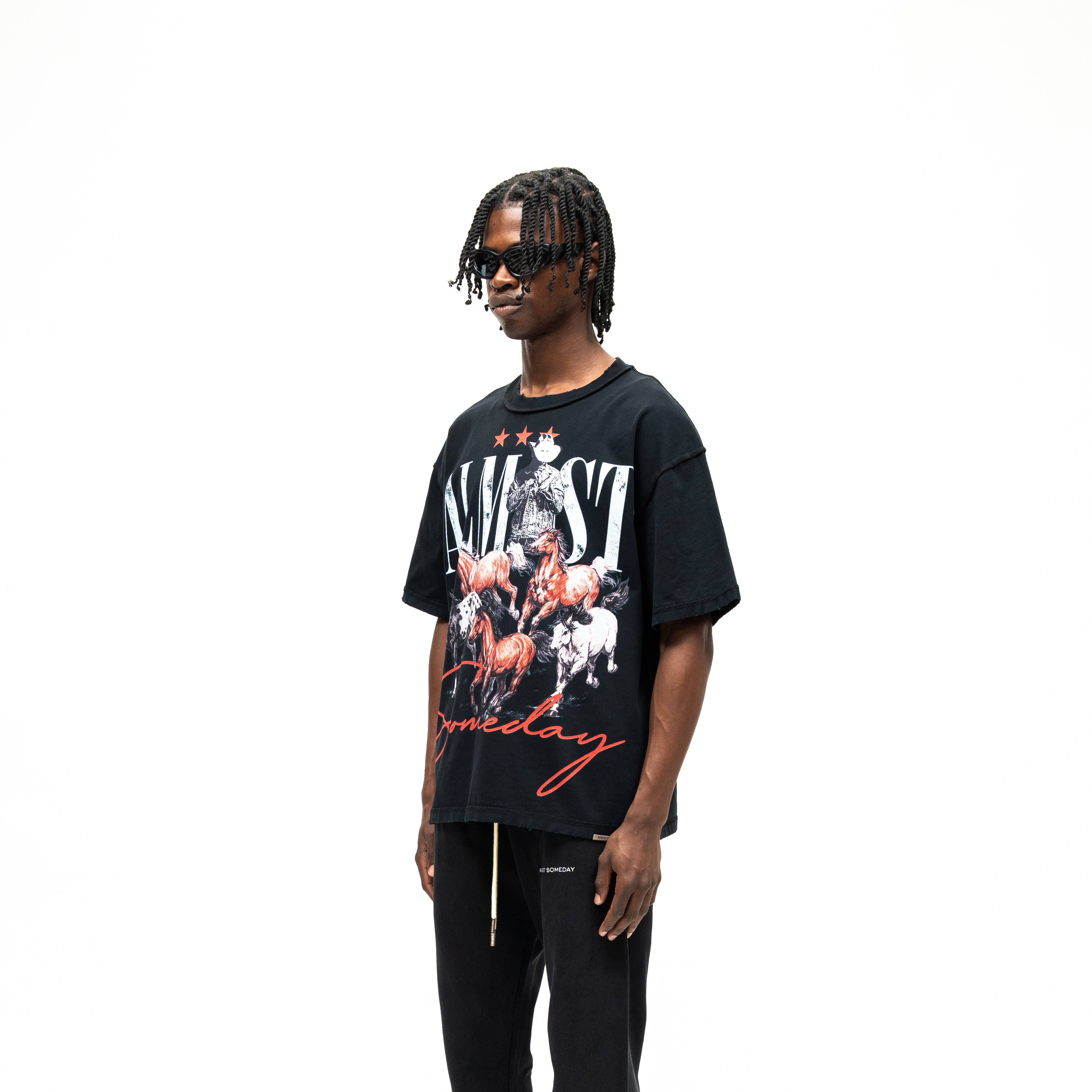 Smoke Tee – Black – Three-quarter front view on model showing large horse graphic and wide short sleeves