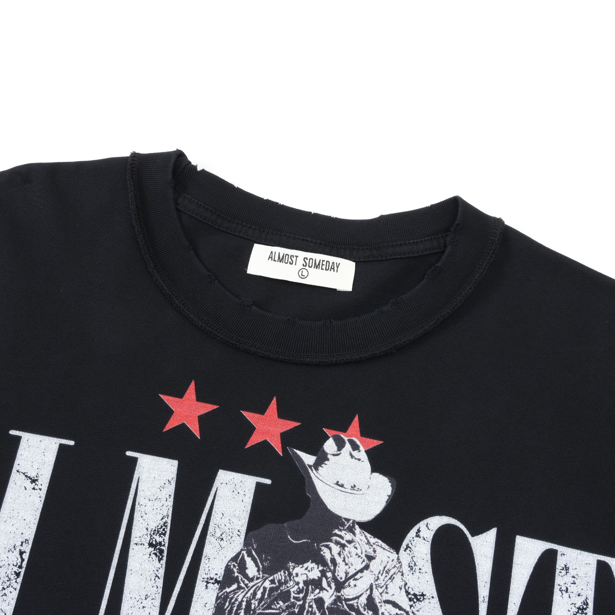 Smoke Tee – Black – Close-up of ribbed crew neckline, Almost Someday neck label, and red stars above cowboy artwork
