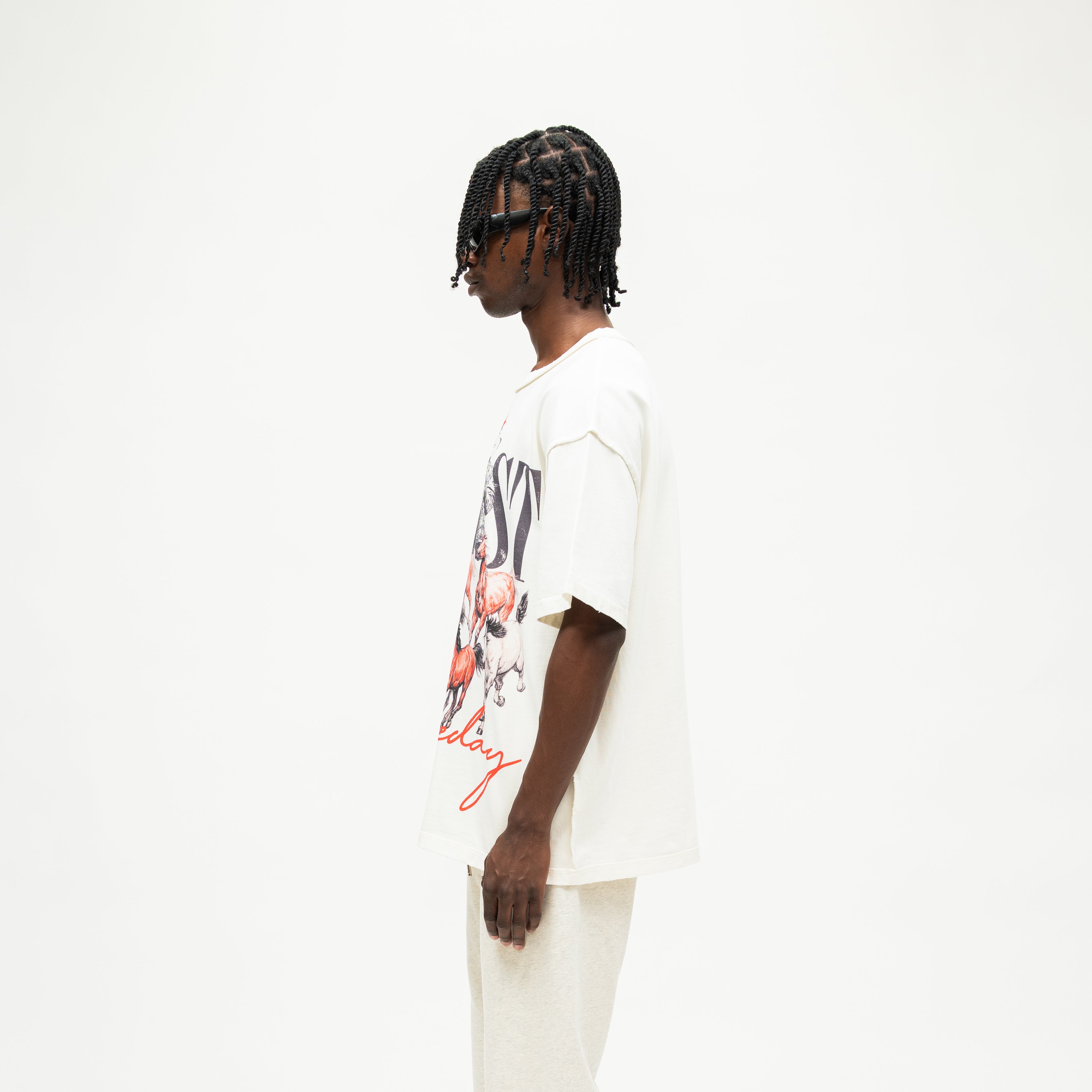 Smoke Tee – Cream – Side view on model showing dropped shoulder, short sleeve, and straight hem