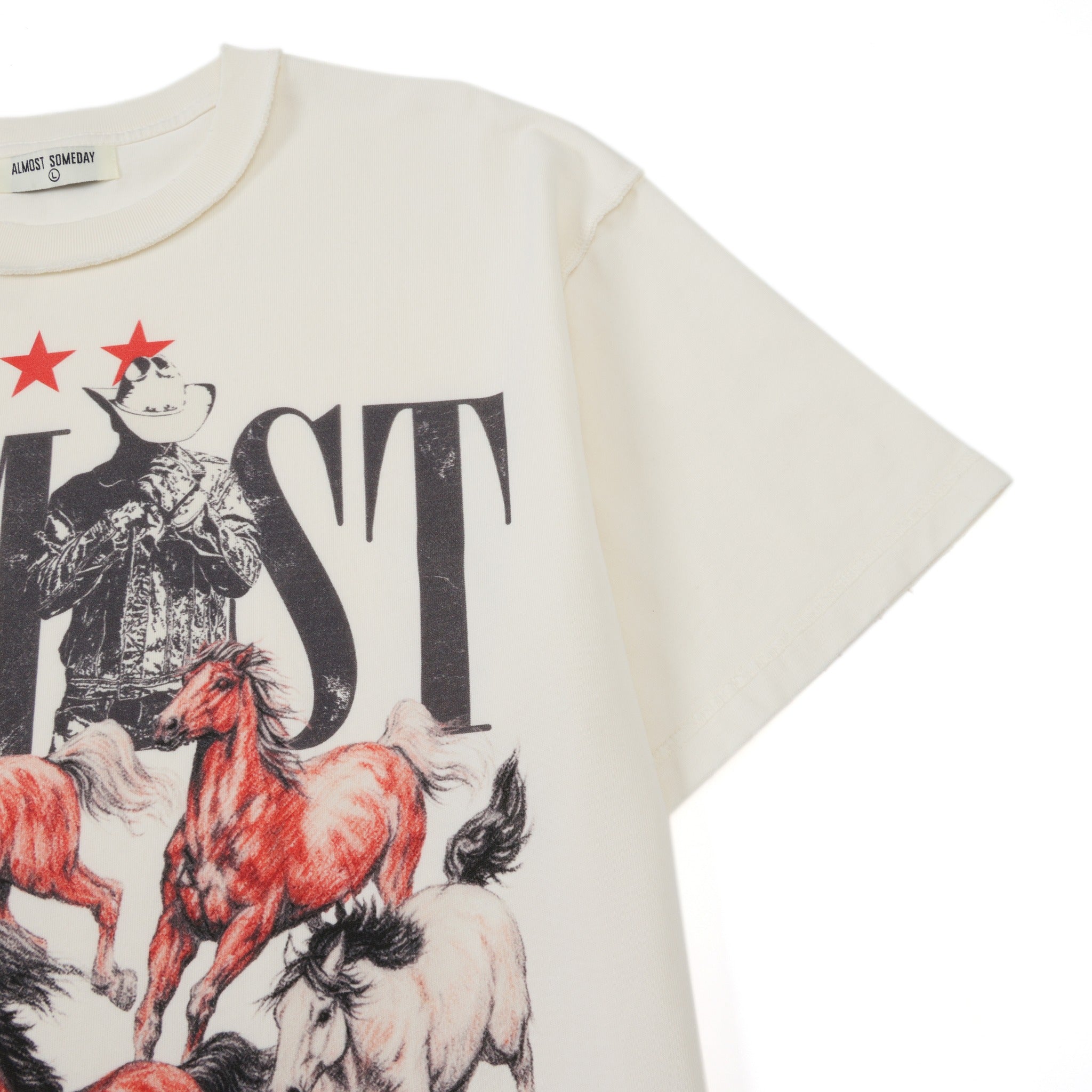 Smoke Tee – Cream – Close-up of short sleeve, shoulder seam, and partial cowboy and horse artwork