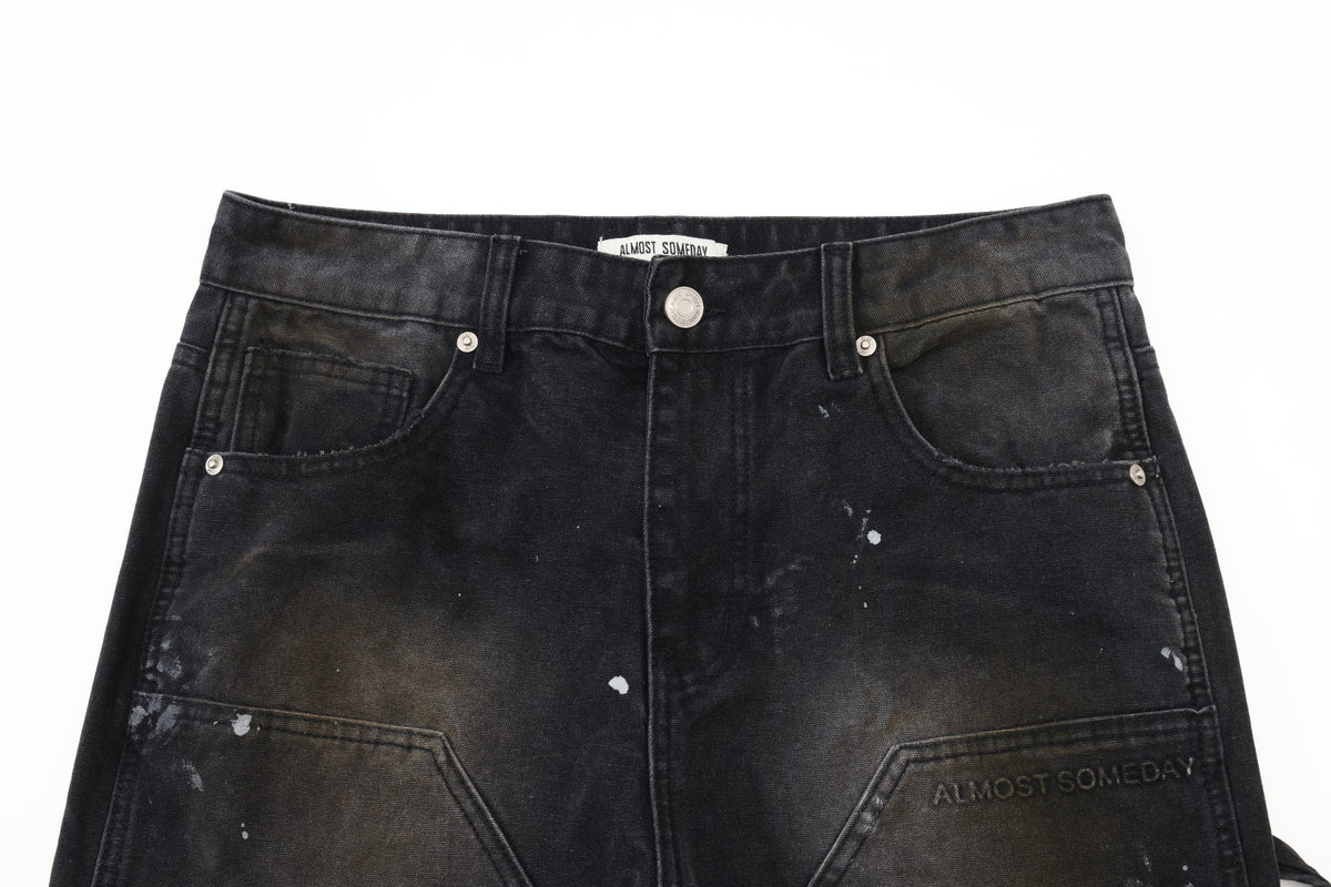Spade Pants – Black – Close-up of waistband, silver-tone button and rivets, front pockets, and faded upper panels