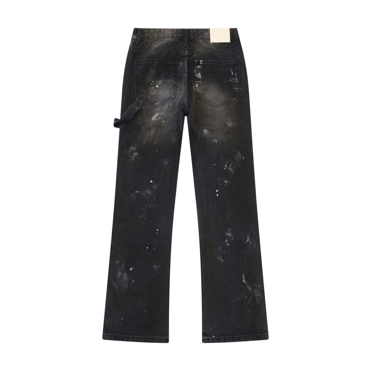 Spade Pants – Black – Back flat lay showing rear patch pockets, cream waistband patch, utility loop, and paint splatters