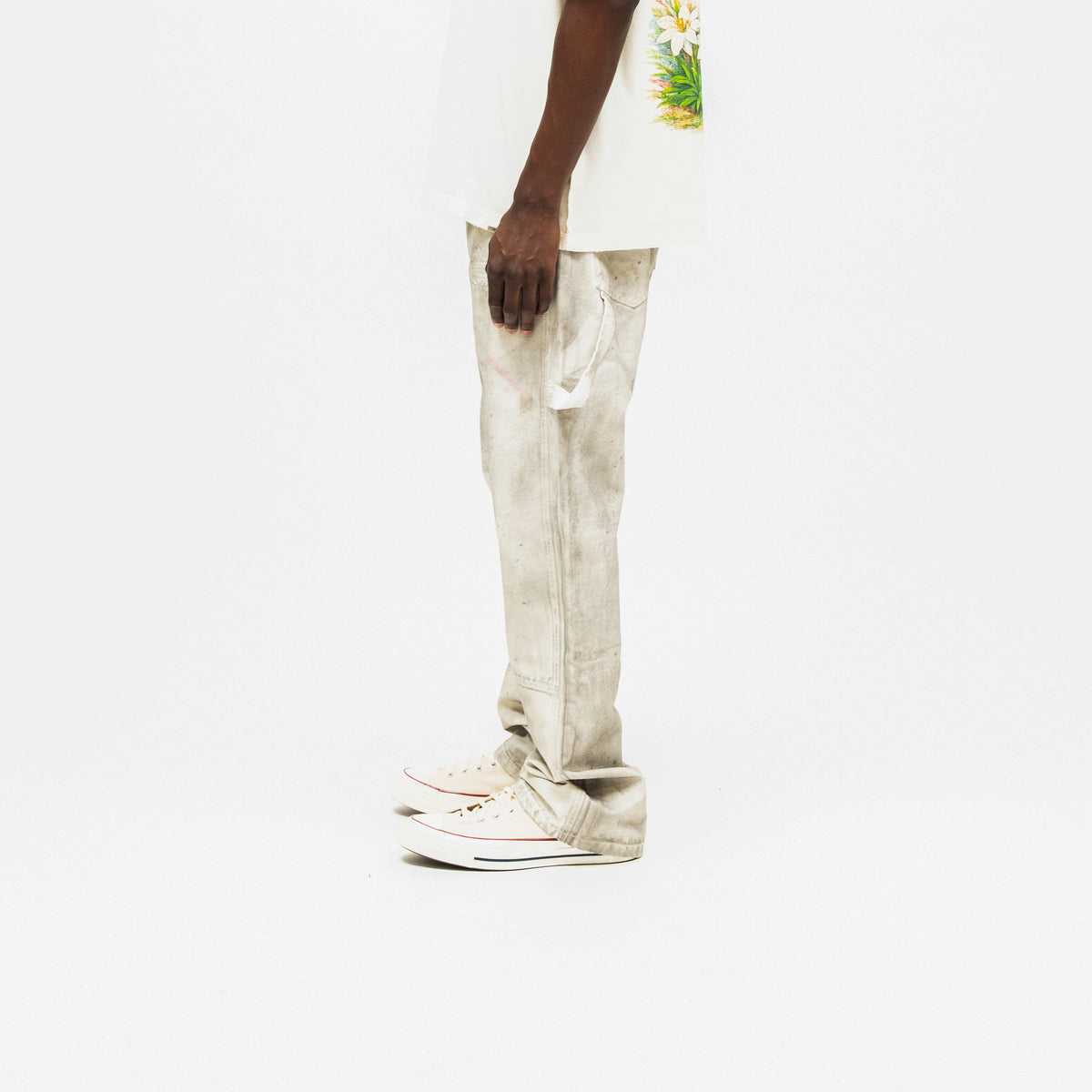 Spade Pants – Cream – Side view on model styled with white tee, showing utility loop, side seam, and stacked hem