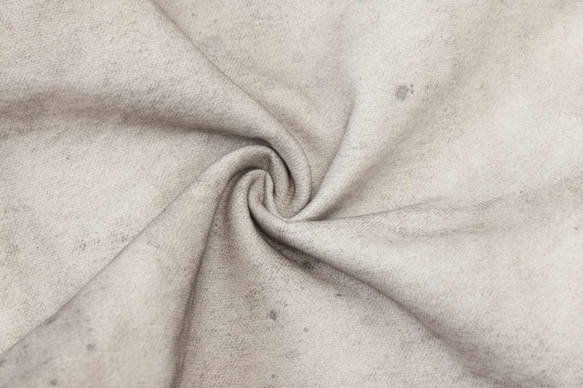 Spade Pants – Cream – Close-up of gathered cream fabric showing texture and gray speckled markings